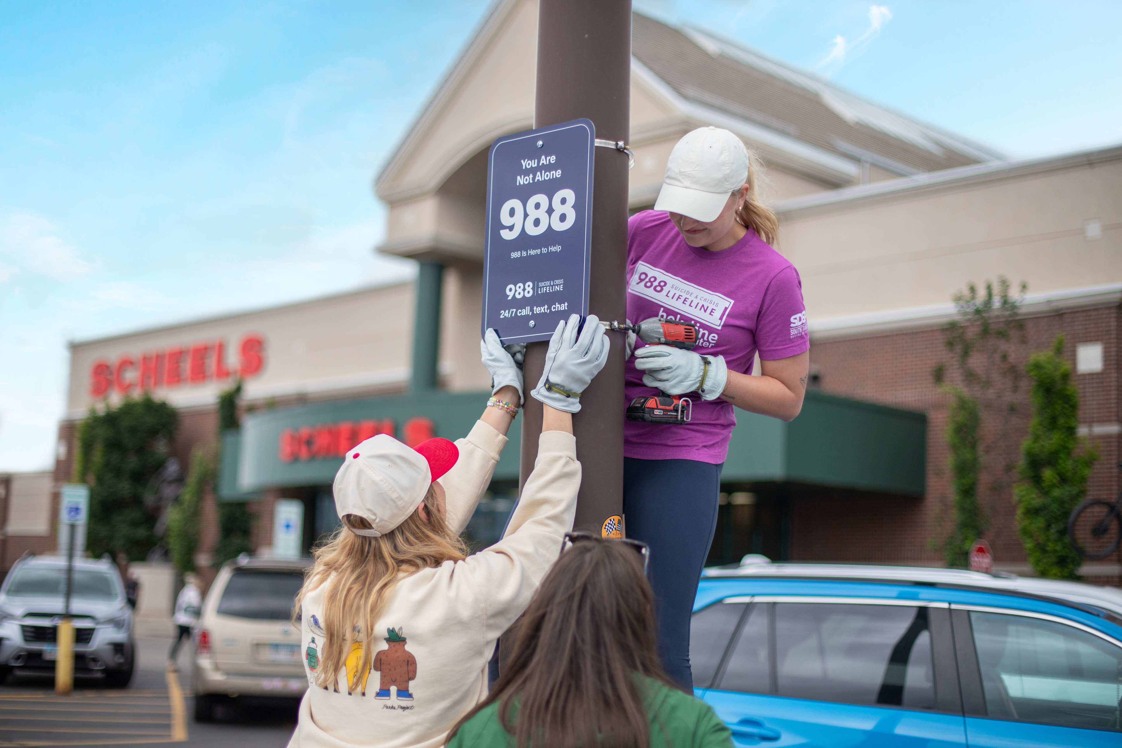 988 Sign Installation Brings Awareness