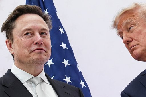 President Donald Trump, right, presents the National Medal of Science to Elon Musk at the U.S. Institute of Peace, Thursday, Oct. 8, 2026, in Washington. (AP Photo/Julia Demaree Nikhinson)