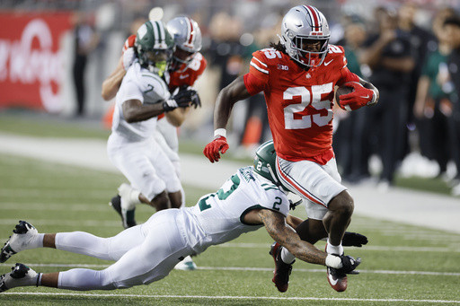 Sayin passes for 3 touchdowns, top-ranked Ohio State pulls away in second half to defeat Ohio 37-9