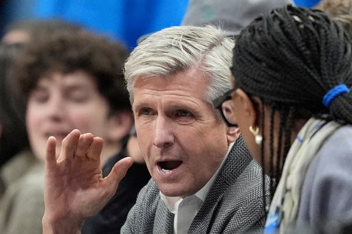 FILE - Rick Welts, center, the Dallas Mavericks newly appointed chief executive officer, attends an NBA basketball game against the Los Angeles Clippers in Dallas, Dec. 19, 2024. (AP Photo/Tony Gutierrez, File)