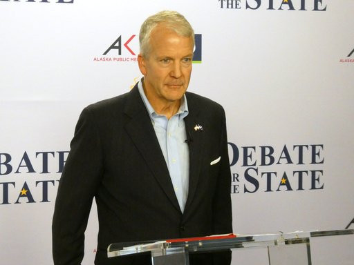 In this photo shot with a smart phone, Alaska Republican U.S. Sen. Dan Sullivan poses ahead of a debate with Democrat Mary Peltola in Alaska's Senate race, Thursday, Oct. 15, 2026, in Anchorage, Alaska. (AP Photo/Becky Bohrer)