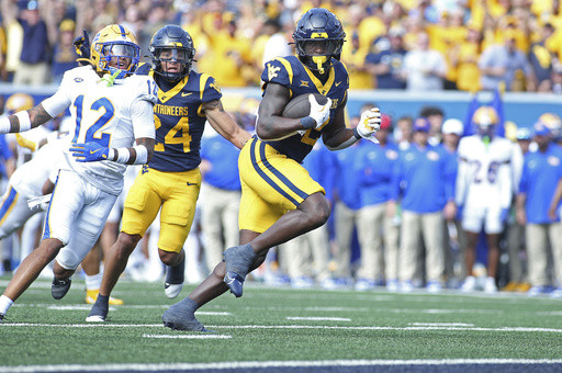 Edwards’ short TD run in overtime leads West Virginia over Pittsburgh 31-24 in the Backyard Brawl