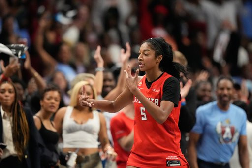 Atlanta Dream's Angel Reese reacts after scoring a three-pointer during the second half of Game 6 of the WNBA basketball finals against the Golden State Valkyries on Thursday, Oct. 29, 2026, in Atlanta. (AP Photo/Brynn Anderson)