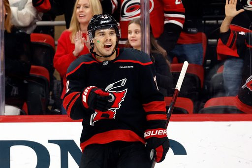 Carolina Hurricanes' Logan Stankoven (22) celebrates after his goal during the second period of an NHL hockey game against the Columbus Blue Jackets in Raleigh, N.C., Thursday, Oct. 29, 2026. (AP Photo/Karl DeBlaker)