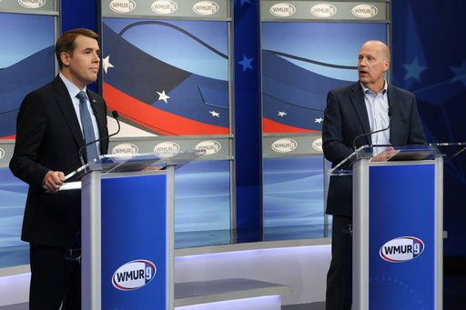 Republican Senate candidate John E. Sununu, right, debates Democratic Senate candidate Rep. Chris Pappas, D-N.H., Wednesday, Oct. 28, 2026, in Manchester, N.H. (AP Photo/Reba Saldanha)