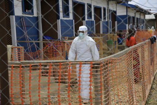 A healthcare worker walks inside a treatment center for Ebola patients in Beni, North Kivu province, eastern Congo, Tuesday, Oct. 27, 2026. (AP Photo/Sebastien Kitsa Musayi)