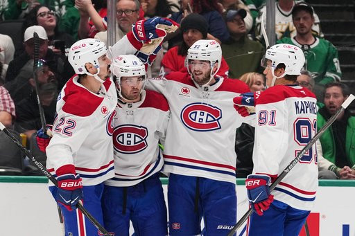 Montréal Canadiens' Chris Kreider (22), Alex Newhook (15), Noah Dobson (53) and Oliver Kapanen (91) celebrate after Newhook scored against the Dallas Stars in the second period of an NHL hockey game in Dallas, Thursday Oct. 29, 2026. (AP Photo/Tony Gutierrez)