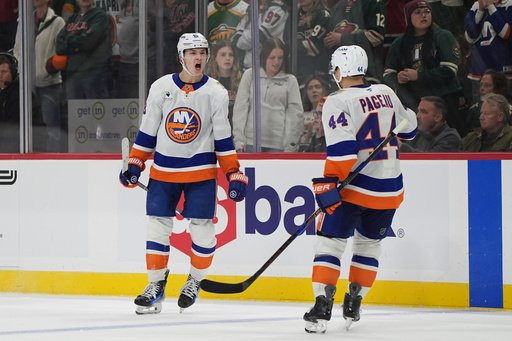 New York Islanders defenseman Matthew Schaefer, left, celebrates next to center Jean-Gabriel Pageau (44) after scoring the winning goal during overtime of an NHL hockey game against the Minnesota Wild, Thursday, Oct. 29, 2026, in St. Paul, Minn. (AP Photo/Abbie Parr)