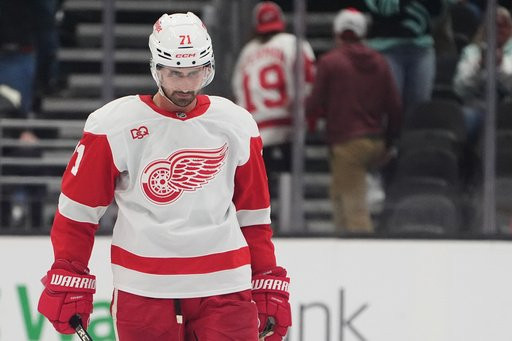 Detroit Red Wings center Dylan Larkin reacts after his attempt was blocked by Seattle Kraken goaltender Philipp Grubauer for a Kraken win during a shootout in an NHL hockey game Tuesday, Oct. 20, 2026, in Seattle. (AP Photo/Lindsey Wasson)
