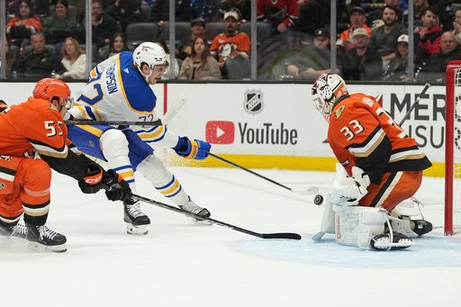 Buffalo Sabres center Tage Thompson, center, scores a goal past Anaheim Ducks goaltender Ville Husso (33) during the first period of an NHL hockey game Thursday, Oct. 29, 2026, in Anaheim, Calif. (AP Photo/Gregory Bull)