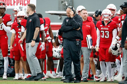 North Carolina State head coach Dave Doeren, center, stands on the sideline during the second half of an NCAA college football game against Wake Forest in Raleigh, N.C., Saturday, Oct. 10, 2026. (AP Photo/Karl DeBlaker)