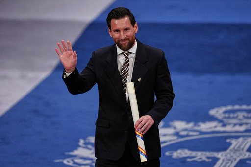 Lionel Messi waves after receiving the Princess of Asturias Award for Sports during a ceremony in Oviedo, northern Spain, Friday, Oct. 23, 2026. (AP Photo/Miguel Oses)