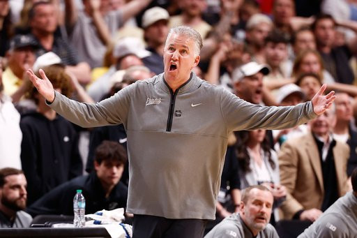 FILE - Purdue head coach Matt Painter argues a call during the first half in the Elite Eight of the NCAA college basketball tournament against Arizona, March 28, 2026, in San Jose, Calif. (AP Photo/Kelley L Cox, File)