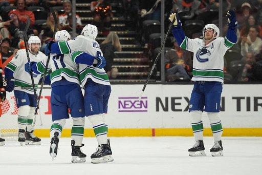 Hronek’s OT power-play goal caps the Canucks’ 6-5 comeback win over the Ducks