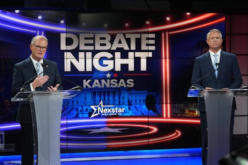 Republican Sen. Roger Marshall, right, and Democratic nominee for U.S. Senate Adam Hamilton participate in a debate in Kansas City, Mo., Wednesday, Oct. 21, 2026. (AP Photo/Charlie Riedel, Pool)