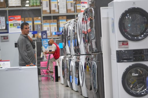 A shopper looks at appliances at a hardware store Tuesday, Oct. 6, 2026, in Dallas. (AP Photo/LM Otero)