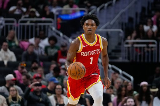 Houston Rockets guard Amen Thompson handles the ball during the first half of an NBA basketball game against the Milwaukee Bucks Wednesday, Oct. 28, 2026, in Milwaukee. (AP Photo/Kayla Wolf)