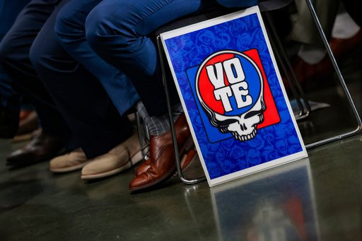 A Grateful Dead vote poster is propped against a chair during a rally with members of the state's Democratic Party, organized labor, and other advocates in San Francisco, Friday, Oct. 23, 2026. (AP Photo/Heather Diehl)