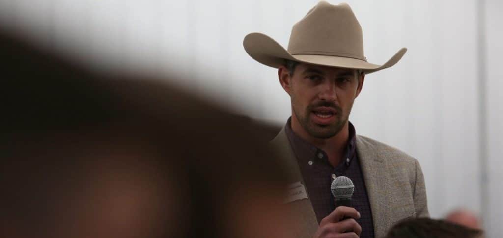 Rancher using a microphone at meeting