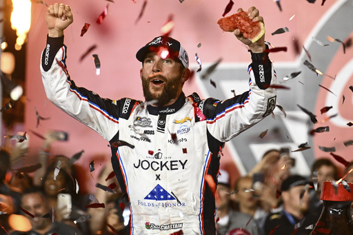Ross Chastain celebrates in Victory Lane after winning a NASCAR Cup Series auto race at Charlotte Motor Speedway, Sunday, May 25, 2025, in Concord, N.C. (AP Photo/Matt Kelley)