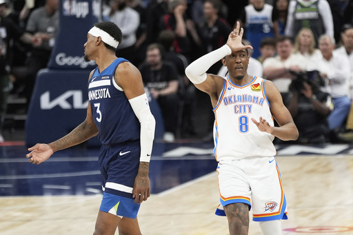 Oklahoma City Thunder forward Jalen Williams (8) gestures after making a 3-point basket next to Minnesota Timberwolves forward Jaden McDaniels (3) during the second half of Game 4 of the Western Conference finals of the NBA basketball playoffs Monday, May 26, 2025, in Minneapolis. (AP Photo/Abbie Parr)