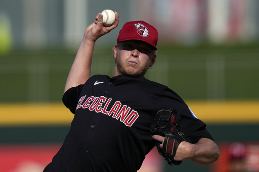 FILE - Cleveland Guardians pitcher Nic Enright throws in the ninth inning of a spring training baseball game against the Oakland Athletics, Tuesday, Feb. 27, 2024, in Goodyear, Ariz. (AP Photo/Carolyn Kaster, File)