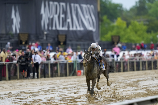 Margie's Intention, with jockey Flavien Prat, wins the 149th running of the Black-Eyed Susan horse race Friday, May 16, 2025, in Baltimore. (AP Photo/Stephanie Scarbrough)