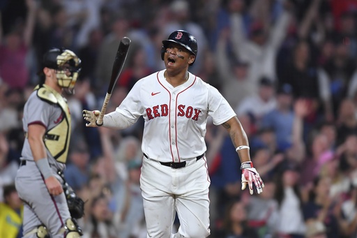 Boston Red Sox's Rafael Devers, right, reacts as he starts to run the bases after hitting a walkoff home run in the ninth inning of a baseball game against the Atlanta Braves, Saturday, May 17, 2025, in Boston. (AP Photo/Steven Senne)