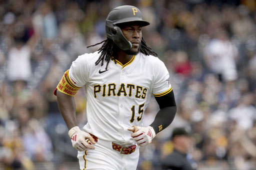 Pittsburgh Pirates' Oneil Cruz rounds the bases after hitting a home run during the third inning of a baseball game against the Milwaukee Brewers, Sunday, May 25, 2025, in Pittsburgh. (AP Photo/Matt Freed)