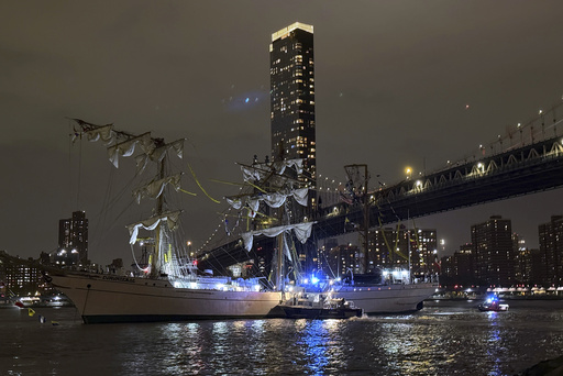 A masted Mexican Navy training ship, the Cuauhtémoc, sits stranded after colliding with the Brooklyn Bridge in New York on Saturday, May 17, 2025. (AP Photo/Kyle Viterbo)