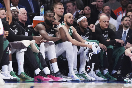 Boston Celtics' Jaylen Brown, third from left, watches with teammates during the second half of Game 6 in the Eastern Conference semifinals of the NBA basketball playoffs against the New York Knicks Friday, May 16, 2025, in New York. (AP Photo/Frank Franklin II)