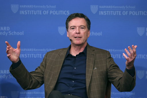 FILE - Former FBI director James Comey gestures while speaking at Harvard University's Institute of Politics' JFK Jr. Forum in Cambridge, Mass., Feb. 24, 2020. (AP Photo/Charles Krupa, File)