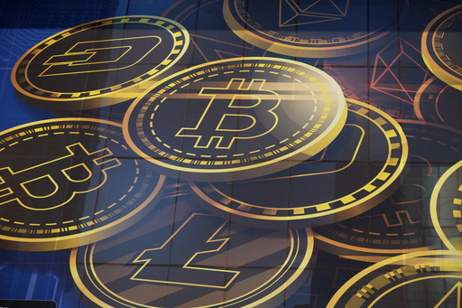 FILE - An advertisement for the cryptocurrency, Bitcoin, is displayed on a building in Hong Kong on Nov. 18, 2021. (AP Photo/Kin Cheung, File)