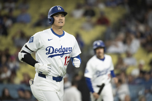 Los Angeles Dodgers' Shohei Ohtani jogs back to the dugout after grounding out during the eighth inning of a baseball game against the Arizona Diamondbacks in Los Angeles, Monday, May 19, 2025. (AP Photo/Kyusung Gong)