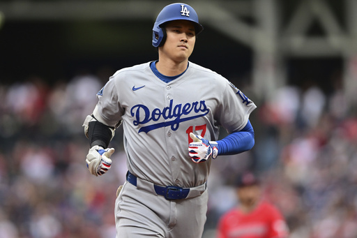 Los Angeles Dodgers' Shohei Ohtani runs the bases after hitting a two run home run off Cleveland Guardians starting pitcher Tanner Bibee during the fourth inning of a baseball game, Tuesday, May 27, 2025, in Cleveland. (AP Photo/David Dermer)