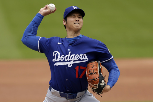Los Angeles Dodgers' Shohei Ohtani (17), of Japan, throws live batting practice before a baseball game against the New York Mets on Sunday, May 25, 2025, in New York. (AP Photo/Adam Hunger)