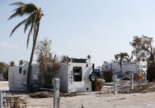 FILE - In this Thursday, Sept. 21, 2017, photo, the remains of damaged and overturned trailers sit at the Sunshine Key RV Resort and Marina, in Big Pine Key, Fla. Monroe County is asking mobile home park owners to allow FEMA to set up temporary housing on their properties. (AP Photo/Wilfredo Lee, File)
