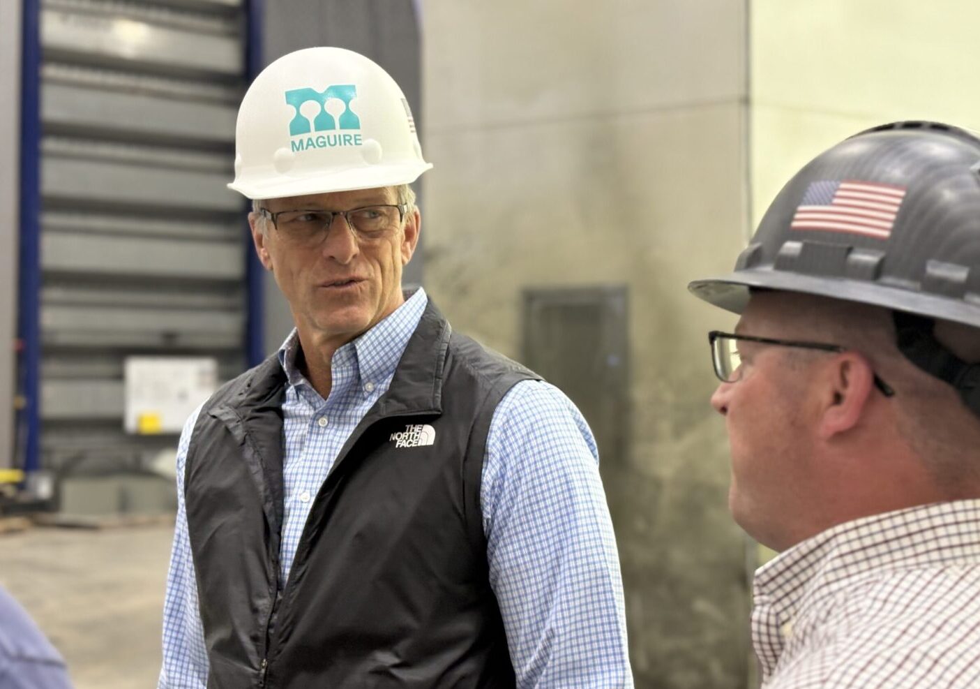 U.S. Senate Majority Leader John Thune, R-South Dakota, speaks with staff at Maguire, a water tower manufacturer and maintainer in Sioux Falls, during a visit on May 27, 2025. (Joshua Haiar/South Dakota Searchlight)