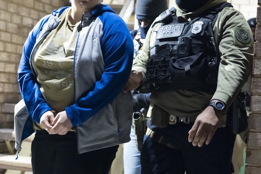 FILE - U.S. Immigration and Customs Enforcement officers detain a person, left, Monday, Jan. 27, 2025, in Silver Spring, Md. (AP Photo/Alex Brandon, File)