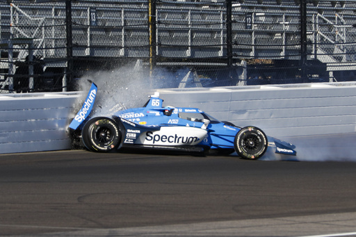 Marcus Armstrong, of New Zealand, hits the wall in the first turn during practice for the Indianapolis 500 auto race at Indianapolis Motor Speedway in Indianapolis, Saturday, May 17, 2025. (AP Photo/Kirk DeBrunner)