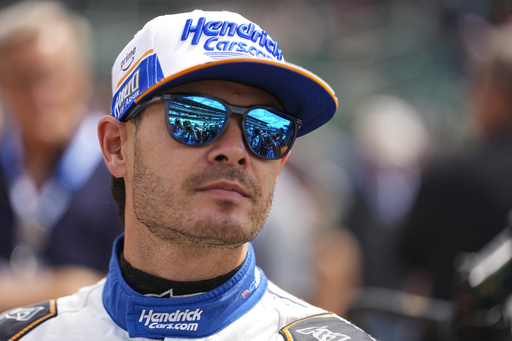 Kyle Larson watches as he waits for is turn during qualification for the Indianapolis 500 auto race at Indianapolis Motor Speedway in Indianapolis, Saturday, May 17, 2025. (AP Photo/Michael Conroy)