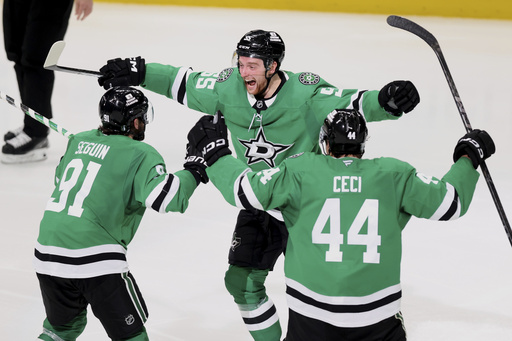 Dallas Stars' Tyler Seguin (91), Thomas Harley (55) and Cody Ceci (44) celebrate after Harley scored in overtime in Game 6 of a second-round NHL hockey playoff series against the Winnipeg Jets in Dallas, Saturday, May 17, 2025. (AP Photo/Gareth Patterson)