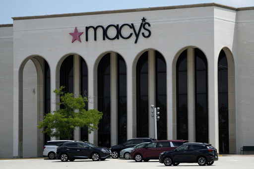 FILE - Cars are parked in front of a Macy's store at Hawthorn Mall in Vernon Hills, Ill., June 3, 2024.(AP Photo/Nam Y. Huh, file)