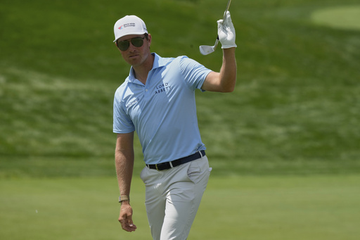 Ben Griffin reacts after sinking his shot on the 18th green during the first round of the Memorial golf tournament Thursday, May 29, 2025, in Dublin, Ohio. (AP Photo/Sue Ogrocki)