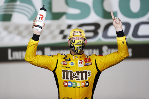FILE - Kyle Busch (54) celebrates after winning the NASCAR Xfinity Series auto race at Charlotte Motor Speedway, May 25, 2020, in Concord, N.C. (AP Photo/Gerry Broome, file)
