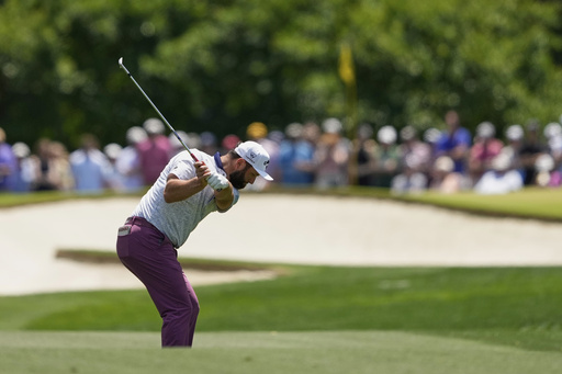 Jon Rahm, of Spain, hits from the fairway on the fifth hole during the third round of the PGA Championship golf tournament at the Quail Hollow Club, Saturday, May 17, 2025, in Charlotte, N.C. (AP Photo/Matt York)