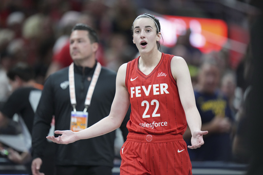 Indiana Fever guard Caitlin Clark (22) reacts after being called for a flagrant foul on Chicago Sky forward Angel Reese during the second half an WNBA basketball game in Indianapolis, Saturday, May 17, 2025. (AP Photo/AJ Mast)