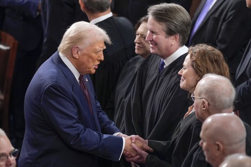 FILE - President Donald Trump, left, greets justices of the Supreme Court, from left, Elena Kagan, Brett Kavanaugh and Amy Coney Barrett, before addressing a joint session of Congress at the Capitol in Washington, March 4, 2025. (AP Photo/J. Scott Applewhite, File)