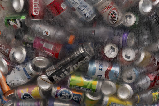 Used beverage containers are seen in a bag outside the Glisan BottleDrop Redemption Center on Thursday, May 15, 2025, in Portland, Ore. (AP Photo/Jenny Kane)