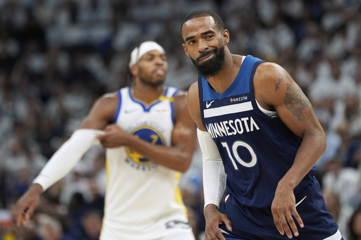 Minnesota Timberwolves guard Mike Conley reacts after Golden State Warriors guard Buddy Hield scores during the first half of Game 5 of an NBA basketball second-round playoff series, Wednesday, May 14, 2025, in Minneapolis. (AP Photo/Abbie Parr)